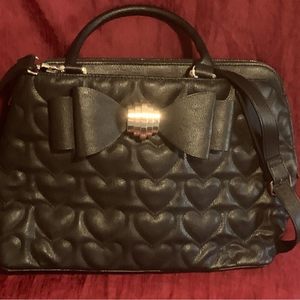Betsy Johnson Purse black with rose petal material inside of purse
